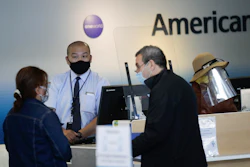 Travelers check in at the American Airlines terminal, Los Angeles International Airport, May 28, 2020.