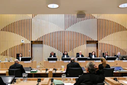 Presiding judge Hendrik Steenhuis, rear fifth from right, opens the court session as the trial resumed for three Russians and a Ukrainian charged with crimes including murder for their alleged roles in the shooting down of Malaysia Airlines Flight MH17 over eastern Ukraine in 2014, at the high security court building at Schiphol Airport, near Amsterdam, Monday, August 31, 2020. Judges and lawyers representing relatives of the 298 people killed are expected to discuss the issue of compensation.