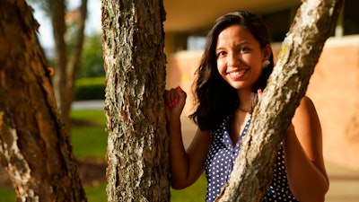 Megan Foster poses for a picture on the campus of the University of North Carolina-Charlotte on Saturday, Aug. 1, 2020, in Charlotte, N.C. The iconic summer job for high school and college students has been on the wane for nearly 20 years. But the pandemic is squeezing even more young people out of the workforce. Foster, a grad student, was unable to get a paid internship or summer job in her field of communications.