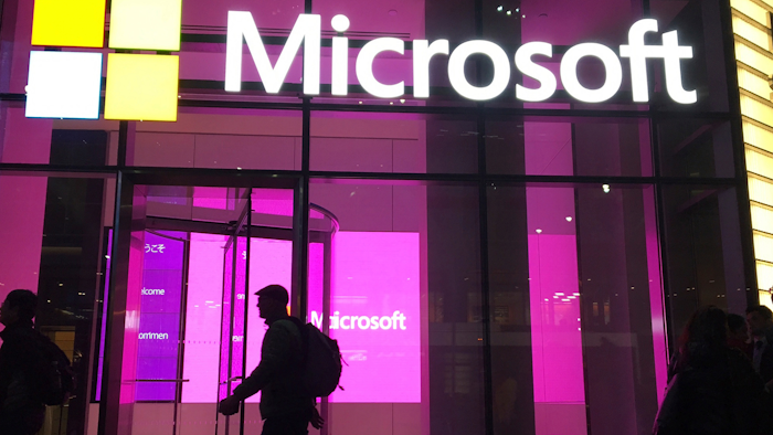 People walk past a Microsoft office in New York, Nov. 10, 2016.