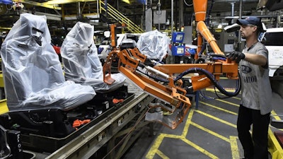 Workers assemble trucks at the Ford Kentucky Truck Plant in Louisville, Oct. 27, 2017.