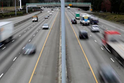 Cars and trucks travel on Interstate 5 near Olympia, Wash.