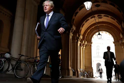 U.K. Prime Minister Boris Johnson walks to his office after a cabinet meeting, London, Sept. 15, 2020.