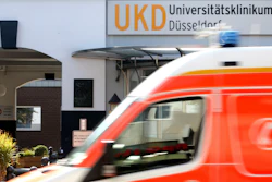 An ambulance drives past the University Hospital in Duesseldorf, Sept. 15, 2020.