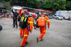 Rescuers arrive at a coal mine in southwest China's Chongqing Municipality.