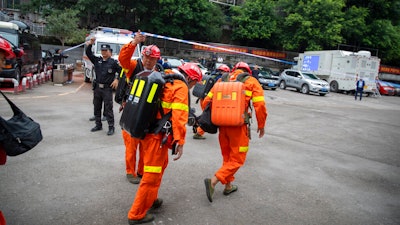 Rescuers arrive at a coal mine in southwest China's Chongqing Municipality.