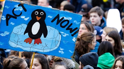 In this Nov. 29, 2019, file photo, young people attend a protest of the Fridays For Future movement in Berlin, Germany. Ten cities around the world on Tuesday, Sept. 22, 2020, joined New York and London in committing to divest from fossil fuel companies as part of efforts to combat climate change. Berlin, Cape Town, Los Angeles, New Orleans, Oslo and others pledged to take “all possible steps to divest city assets from fossil fuel companies and (increase) financial investments in climate solutions.”