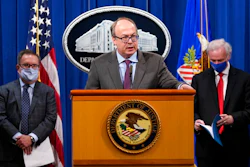 Jeff Clark, Assistant Attorney General for the Environment and Natural Resources Division, speaks as Deputy Attorney General Jeffrey Rosen, right, and Environmental Protection Agency (EPA) Administrator Andrew Wheeler, left, look on during a news conference at the Justice Department in Washington, Monday, Sept. 14, 2020. Automakers Daimler AG and subsidiary Mercedes-Benz USA have agreed to pay $1.5 billion to the U.S. government and California state regulators to resolve emissions cheating allegations.