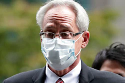 In this Sept. 15, 2020, file photo, former Nissan Motor Co. executive Greg Kelly arrives for the first trial hearing at the Tokyo District Court in Tokyo. A Nissan employee testified Tuesday, Sept. 29, 2020 that he worked with another former Nissan executive, American Greg Kelly to find ways to pay the automaker's former chairman, Carlos Ghosn without fully disclosing his compensation.