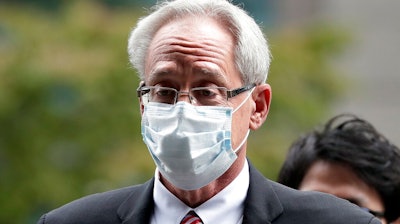 In this Sept. 15, 2020, file photo, former Nissan Motor Co. executive Greg Kelly arrives for the first trial hearing at the Tokyo District Court in Tokyo. A Nissan employee testified Tuesday, Sept. 29, 2020 that he worked with another former Nissan executive, American Greg Kelly to find ways to pay the automaker's former chairman, Carlos Ghosn without fully disclosing his compensation.