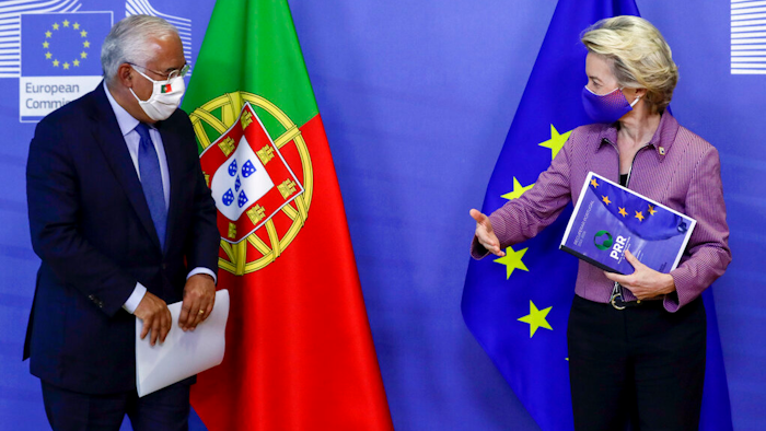 Portugal's Prime Minister Antonio Costa, left, is welcomed by European Commission President Ursula von der Leyen prior to a meeting at EU headquarters in Brussels.