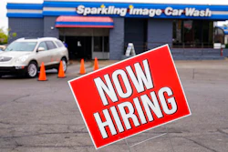 A help wanted sign is displayed at car wash in Indianapolis.