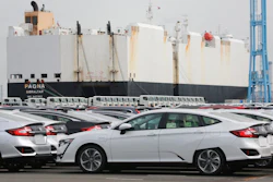 Cars are parked to be exported at Yokohama port, near Tokyo.