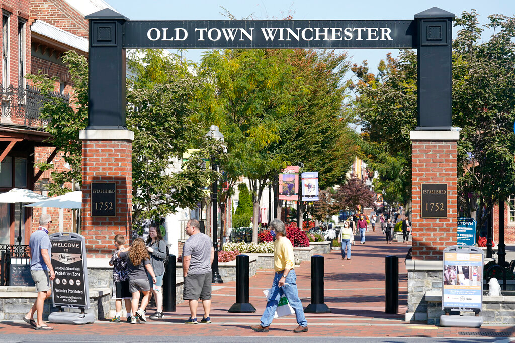 Pedestrians walk along the downtown mall area in the Old Town.