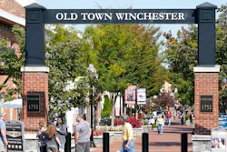 Pedestrians walk along the downtown mall area in the Old Town.