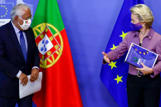 Portugal's Prime Minister Antonio Costa, left, is welcomed by European Commission President Ursula von der Leyen prior to a meeting at EU headquarters in Brussels.