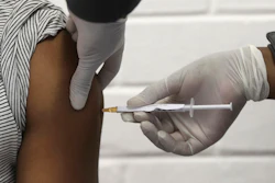 A volunteer receives an injection at the Chris Hani Baragwanath hospital in Soweto, Johannesburg, June 24, 2020.