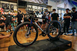 Customers wearing face masks to help curb the spread of the coronavirus look at a newly unveiled new model from the American bicycle brand at a retailed shop in Beijing on July 29, 2020. China's trade growth accelerated in September as the world's second-largest economy recovered form the coronavirus pandemic.