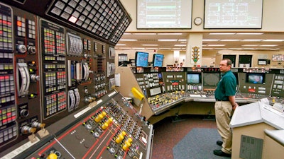In this April 12, 2005, file photo, operator Kevin Holko monitors the control room during a scheduled refueling shutdown at the Perry Nuclear Power Plant in North Perry, Ohio. A federal court docket showed that 'plea agreements' were filed Thursday, Oct. 29, 2020 for defendants Jeffrey Longstreth, a longtime political adviser, and Juan Cespedes, a lobbyist described by investigators as a 'key middleman' in a $60 million bribery case also involving ex-Ohio House Speaker Larry Householder alleged to have helped prop up this aging nuclear power plant and the Davis-Besse Nuclear Power Station in Oak Harbor, Ohio.