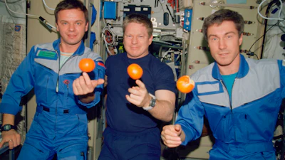 From left, cosmonaut Yuri P. Gidzenko, astronaut Bill Shepherd and cosmonaut Sergei K. Krikalev, onboard the Zvezda Service Module of the International Space Station, Dec. 4, 2000.