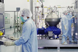 Scientists work with a bioreactor at a company facility in New York state.