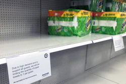 Sign limiting the quantity of paper towels customers can buy at a Target store in Bloomington, Minn., Nov. 17, 2020.