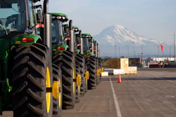 In this Nov. 4, 2019 file photo, John Deere tractors made by Deere & Company are shown as they are readied for export to Asia at the Port of Tacoma in Tacoma, Wash. The U.S. trade deficit fell in September 2020 after hitting a 14-year high in August as exports outpaced imports. The Commerce Department reported, Wednesday, Nov. 4, 2020, the gap between what the U.S. sells and what it buys abroad fell to 63.9 billion in September, a decline of 4.7% from a $67 billion deficit in August.