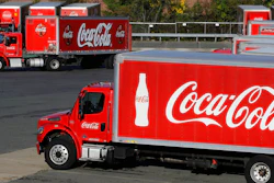 A truck with the Coca-Cola logo.