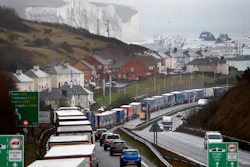 Lorries queue on the approaches to Dover, England, Friday, Dec. 11, 2020. The U.K. left the EU on Jan. 31, but remains within the bloc's tariff-free single market and customs union until the end of the year. British Prime Minister Boris Johnson says there is a 'strong possibility' that talks on a post-Brexit trade agreement with the EU will end without agreement.
