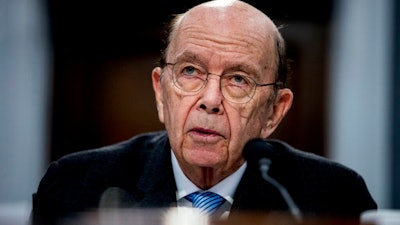 In this Tuesday, March 10, 2020, file photo, Commerce Secretary Wilbur Ross testifies before a House Appropriations subcommittee on Capitol Hill, in Washington. The Trump administration blacklisted China’s top chipmaker Friday, Dec. 18, limiting the Semiconductor Manufacturing International Corporation’s (SMIC) access to advanced U.S. technology because of its alleged ties to the Chinese military. “We will not allow advanced U.S. technology to help build the military of an increasingly belligerent adversary,’’ Ross said.