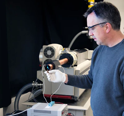 PNNL research scientist Robert Ewing presenting a trace vapor sample to the detector. PNNL, CC BY
