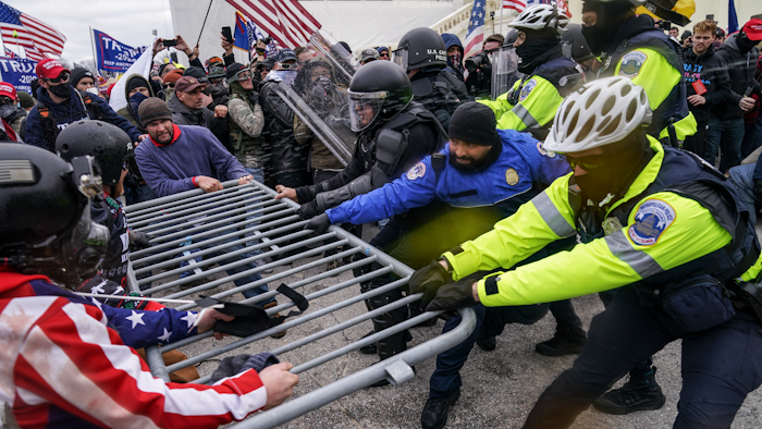 Trump supporters try to break through a police barrier on Wednesday at the Capitol in Washington.