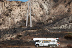 SoCal Edison trucks arrive at the site of a transformer tower in Sylmar, Calif., suspected of being responsible for the Saddleridge fire, Oct. 15, 2019.