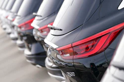 A long row of unsold 2021 QX50 sports-utility vehicles sits at an Infiniti dealership Sunday, Dec. 27, 2020, in Highlands Ranch, Colo. U.S. auto sales are expected to be down only about 15% for the year, with the average price hitting a record high as sales bounced back during the second half of the year.