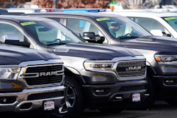 A long row of unsold 2020 pickup trucks sits at a Ram dealership Sunday, Dec. 27, 2020, in Littleton, Colo. A new government report says gas mileage for new vehicles dropped and pollution increased in model year 2019 for the first time in five years.