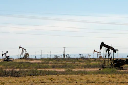This file phot shows oil rigs in a Loco Hills field on U.S. Highway 82 in Eddy County near Artesia, N.M.