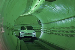 Elon Musk arrives in a modified Tesla Model X during an unveiling event for the Boring Company test tunnel, Hawthorne, Calif., Dec. 18, 2018.