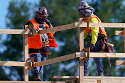 Construction workers talk at a USA Properties Fund site in Simi Valley, California. Hiring has weakened for six straight months.