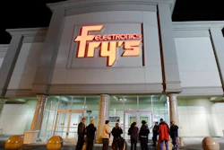 In this Oct. 21, 2009 file photo, a small crowd begins to gather outside a Fry's Electronics store in Renton, Wash. The electronics chain is permanently closing, citing the struggles it faced as a retailer during the coronavirus pandemic. The company, which was in business for 36 years, had 31 stores in nine states. Fry’s Electronics Inc. said it stopped regular operations and began the wind-down process of its business on Wednesday, Feb. 24, 2021.