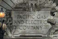 In this file photo, a Pacific Gas & Electric sign is shown outside of a PG&E building in San Francisco.