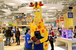 In this Dec. 9, 2019, file photo a girl hugs the Toys R Us mascot, Geoffrey, at the new store at a mall in Paramus, N.J The only two Toys R Us stores that opened in November 2019 as part of a small U.S. comeback attempt by the iconic toy chain have now closed. The Toys R Us store at the Galleria mall in Houston shuttered on Jan. 15, while one at the Garden State Plaza in Paramus, New Jersey, closed on Tuesday, Jan. 26, 2021 according Tru Kids, a new entity formed when it acquired Toys R Us’ intellectual property during its liquidation in 2018.