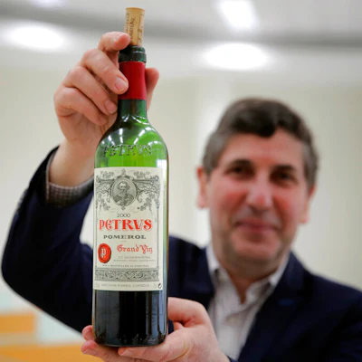 Philippe Darriet, president of the Institute for Wine and Vine Research, holds a bottle of Petrus red wine that spent a year in the International Space Station, Villenave-d'Ornon, France, March 1, 2021.