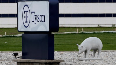 In this May 1, 2020 photo, a sign sits in front of the Tyson Foods plant in Waterloo, IA.