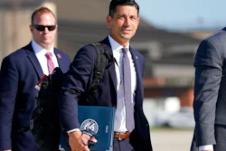 Then acting-Secretary of Homeland Security Chad Wolf, center, at Andrews Air Force Base in Md., Aug. 18, 2020.