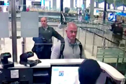 This Dec. 30, 2019, file image from security camera video shows Michael L. Taylor, center, and George-Antoine Zayek at passport control at Istanbul Airport in Turkey. Michael Taylor and his son Peter, suspected of helping former Nissan Chairman Carlos Ghosn skip bail and escape to Lebanon in December 2019 have been extradited to Japan. They were handed over to Japanese custody on Monday, March 1, 2021 and were due to arrive in Tokyo on Tuesday.