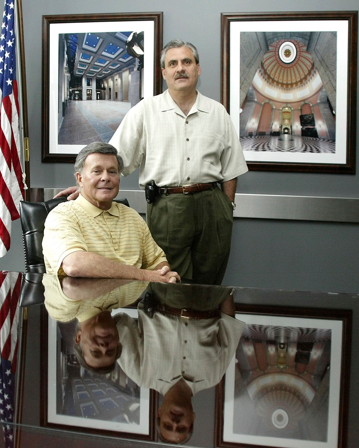 In this file photo Paul Tipps, left, and Neil Clark, pose in their office in Columbus, Ohio.