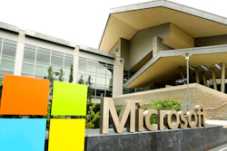 In this July 3, 2014, file photo, the Microsoft Corp. logo is displayed outside the Microsoft Visitor Center in Redmond, Wash. Microsoft will begin bringing workers back to its suburban Seattle global headquarters on March 29, 2021, as the tech giant starts to reopen more facilities it largely shuttered during the coronavirus pandemic.