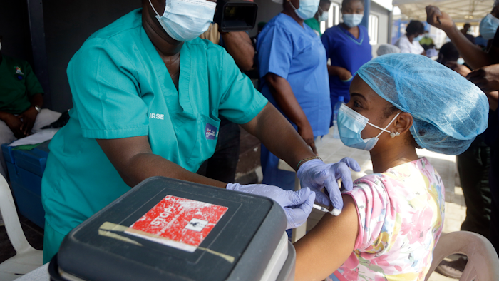 Hospital staff in Lagos, Nigeria, administer the AstraZeneca vaccine.