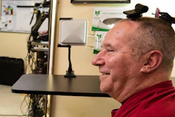 A participant in the BrainGate clinical trial uses wireless transmitters that replace the cables normally used to transmit signals from sensors inside the brain.