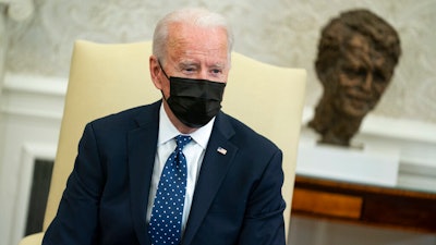 President Joe Biden speaks during a meeting with members of the Congressional Hispanic Caucus in the Oval Office of the White House on Tuesday, April 20, in Washington.